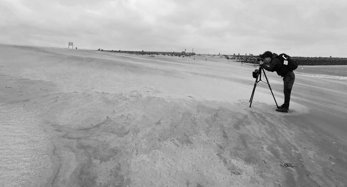 matthias grunsky looks through the view finder of his camera