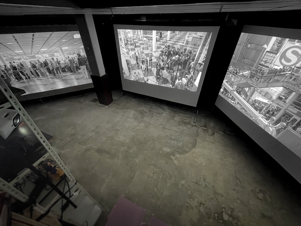 3 screen installation of tourist